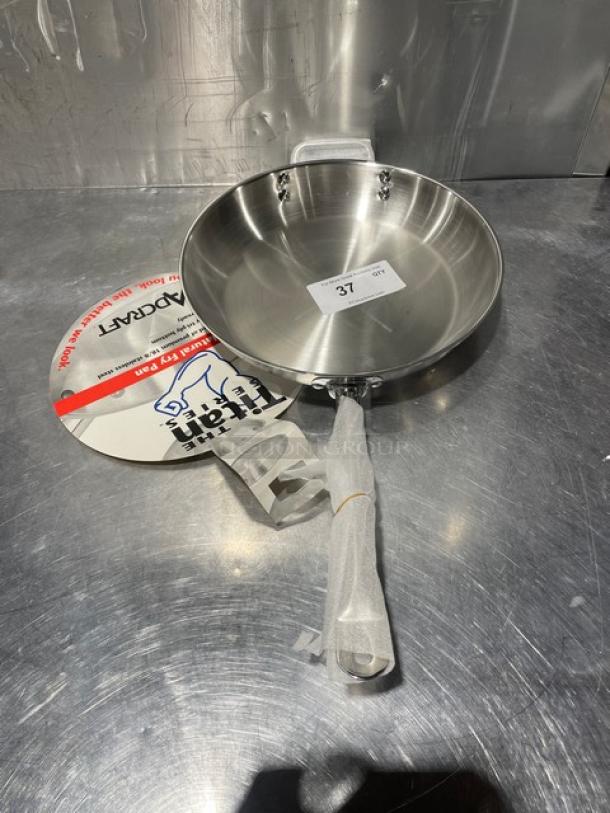 Adcraft 12" stainless steel frying pan, Model FPSI-12, new condition. Includes Titan Series label and wrapped handle.