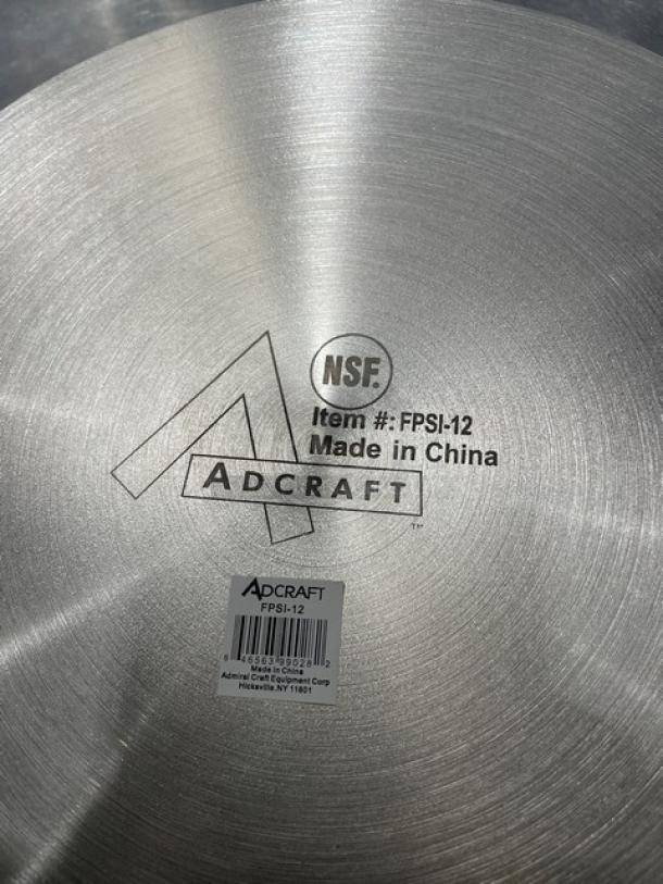 Adcraft 12" frying pan, stainless steel, Model FPSI-12, new condition. Features NSF certification and "Made in China" marking.