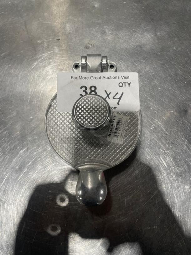 Adcraft AHM-5 aluminum hamburger mold, new condition. Features textured press surface. Includes a label showing quantity "38 x4".