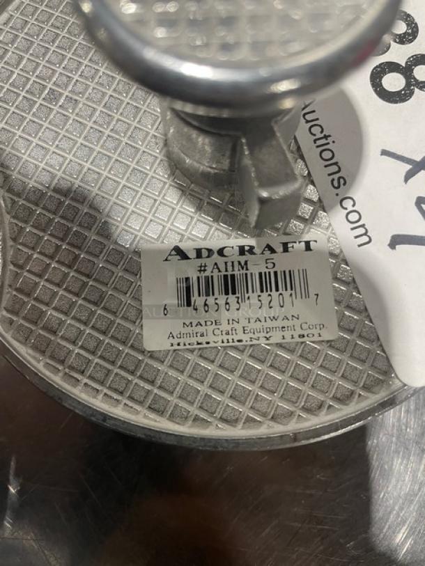 Adcraft Aluminum Hamburger Mold, Model AHM-5, new condition. Features grid pattern surface; tagged "Made in Taiwan."