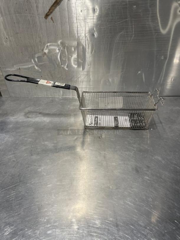 Adcraft frying basket, model FBR-11571, new condition. Features wire mesh and black handle. Tags indicate model and care instructions.