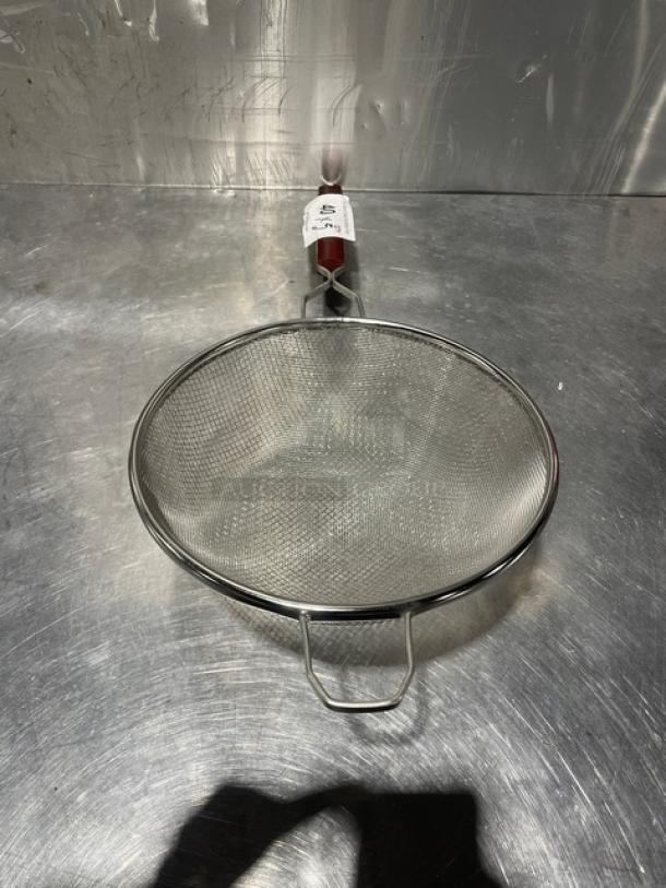 New Adcraft 10" double mesh strainer, model DSM-10, made of stainless steel. Features durable construction and a sturdy handle.