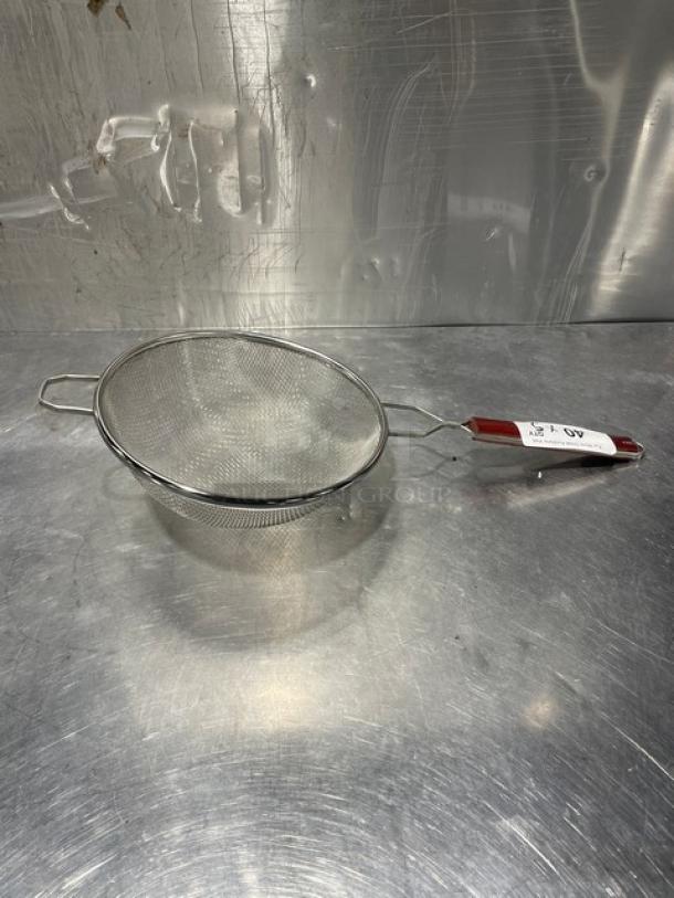 Adcraft DSM-10 deluxe 10" double mesh strainer. Stainless steel with red handle. Unused condition with tag.