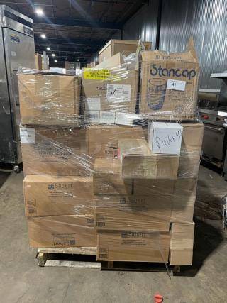 Mixed pallet of commercial kitchen items, wrapped, featuring Bottlebox lime green containers, Sabert sandwich lids, and more.