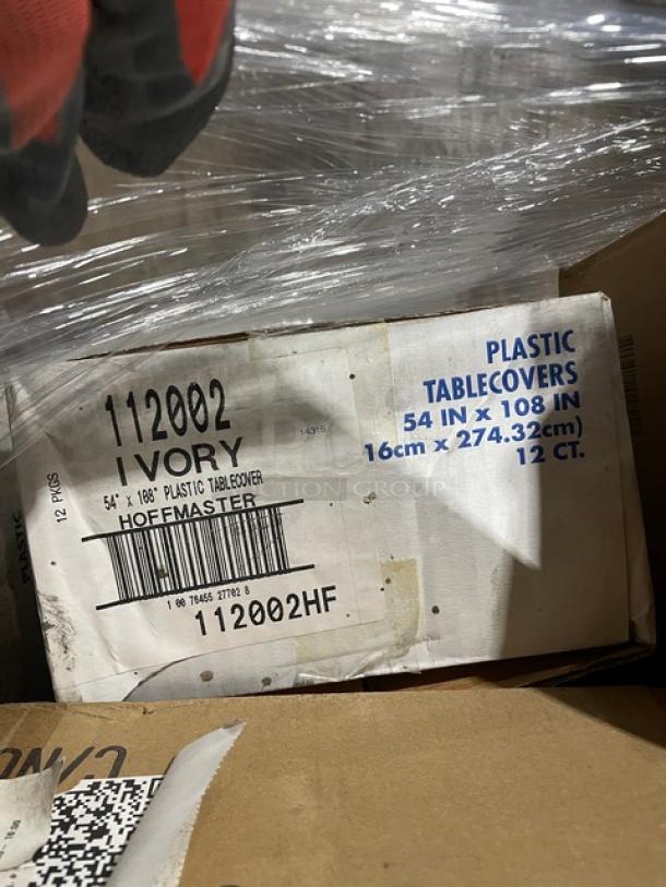 Box of Hoffmaster commercial ivory rectangular plastic table covers, model 112002, 54"x108", 12 count.