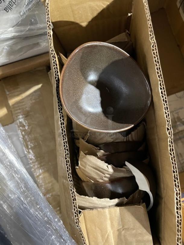 Mixed pallet in a box containing commercial kitchen items such as a sauce/condiment cup. Items appear new and packaged.