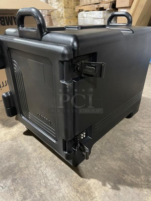 Cambro Ultra Camcarrier black insulated food pan carrier, brand new, with front-loading design and durable latches.