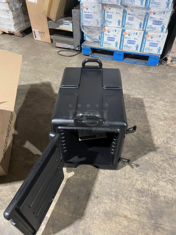 Brand new Cambro Ultra Camcarrier black front-loading insulated hot box. Commercial food pan carrier with open door.