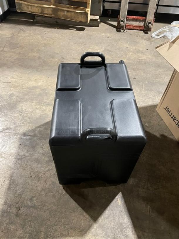 Brand new Cambro Ultra Camcarrier black insulated food pan carrier, front-loading, commercial use, sturdy handles.