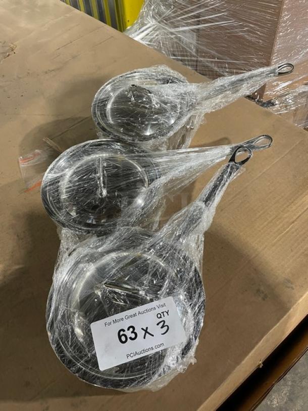 Brand new Mauviel M'Cook 5-Ply stainless steel saucepans with lids, cast handles, wrapped in plastic, set of three.