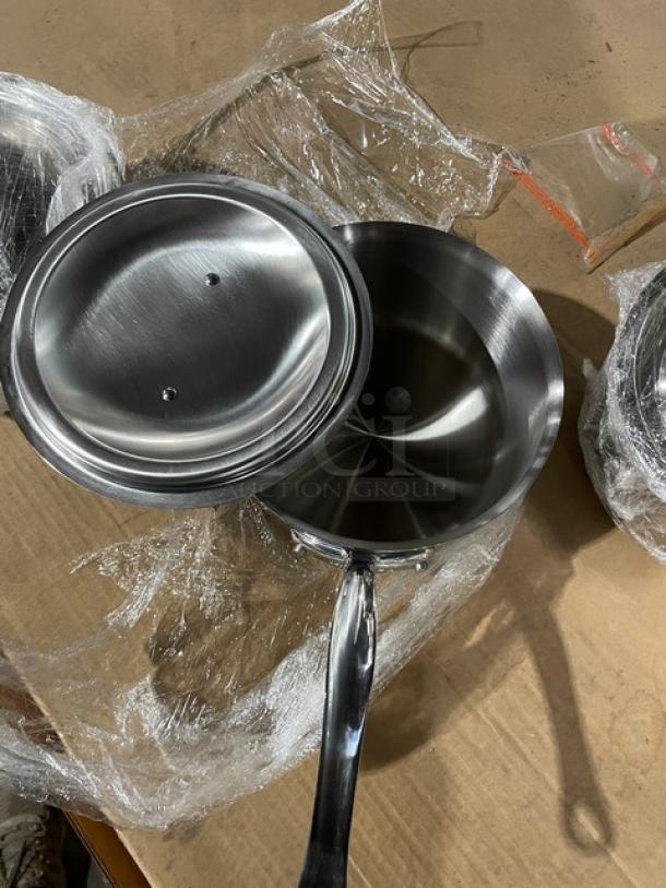 Brand new Mauviel M'Cook stainless steel 5-ply round saucepan with lid, cast handle, pristine condition.