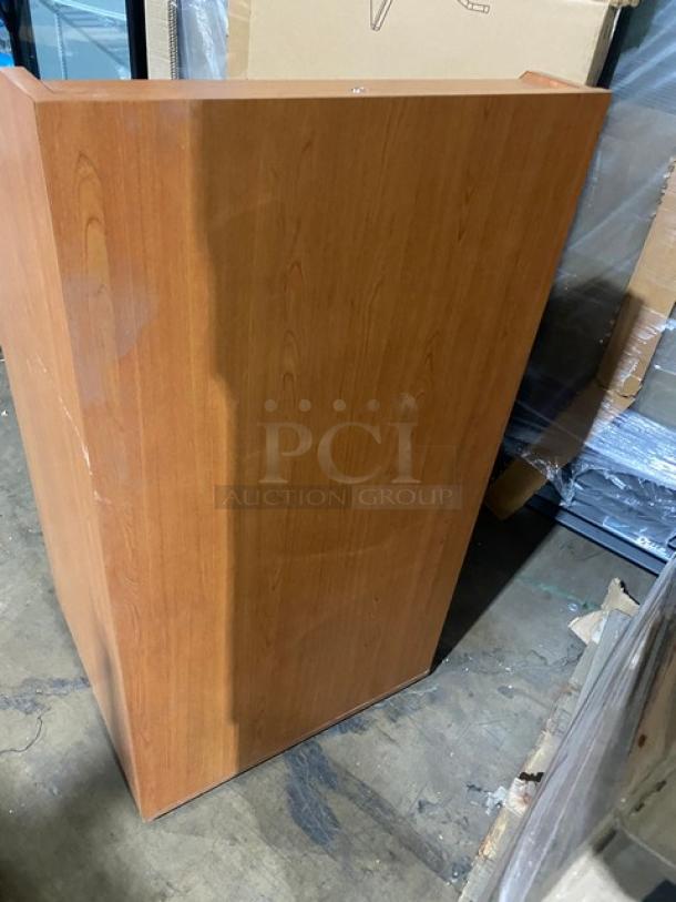 Forbes-AV wooden lectern, new condition, features an integrated equipment rack, enclosed style on legs.