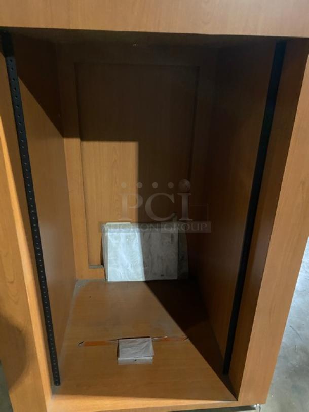NEW Forbes-AV wooden lectern, enclosed style, tan finish, with integrated equipment rack system, on legs.