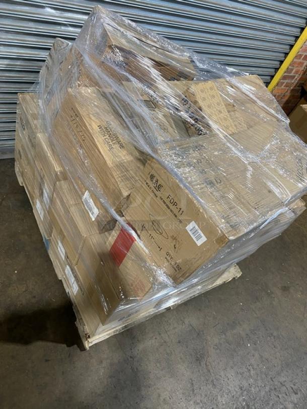 Mixed pallet of commercial kitchenware, including FOH glass buffet boards, wine glasses, bowls, and more, wrapped in plastic.