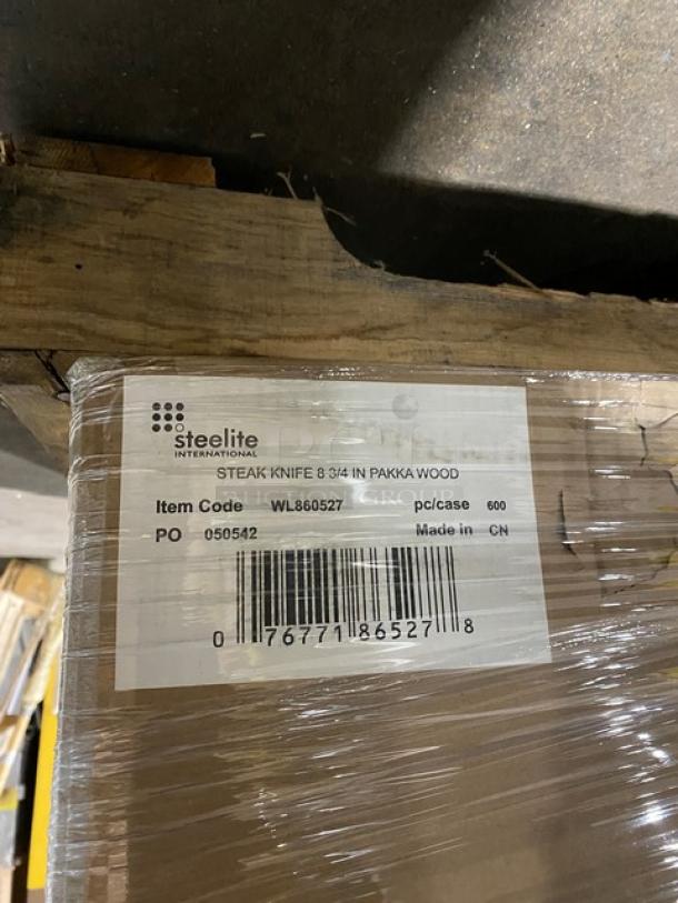 Brand new mixed pallet, showing wrapped items with visible Steelite label indicating steak knives, item code WL860527, 600 pieces per case.
