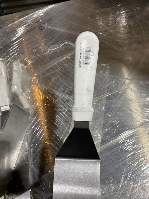 Crestware PHT103 stainless steel turner, 10" with white grip handle. Brand new with label.