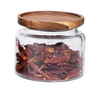Brand new Anchor Hocking 48 oz. mini Montana glass jar with acacia wood lid, model 97692AHG17, containing dried peppers.