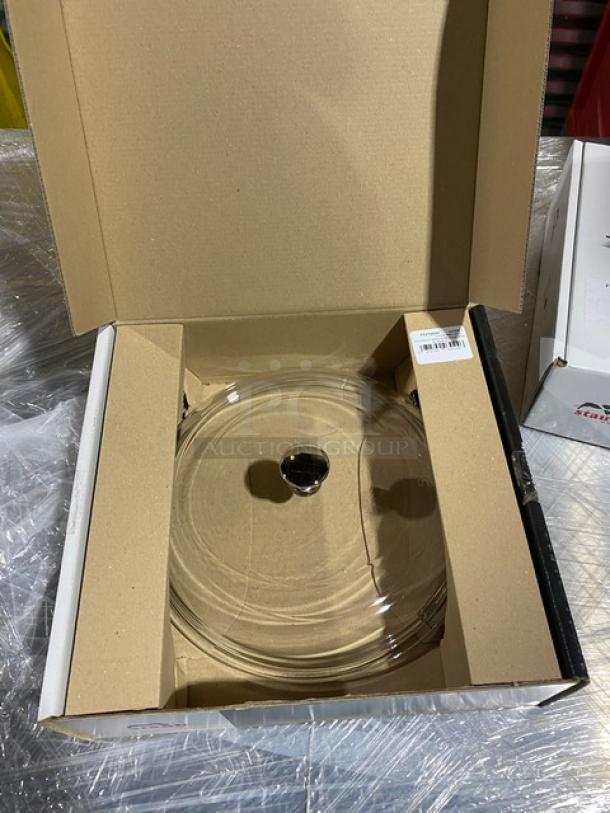 Brand new Staub W4208 clear glass lid in open box. Domed style, pristine condition, includes manufacturer's label.