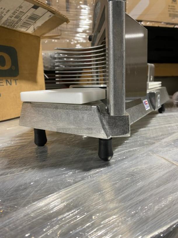 Brand new Nemco Easy Tomato Slicer II, model 56600-2, with 1/4" slicing cartridge. Features raised legs and durable construction.