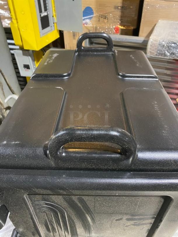 Brand new Cambro Ultra Camcarrier 1318CC, black insulated food pan carrier, front-loading, commercial use.