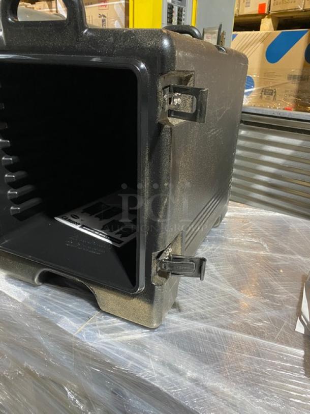 Brand new Cambro Ultra Camcarrier 1318CC, black insulated food pan carrier, front-loading, pristine condition.