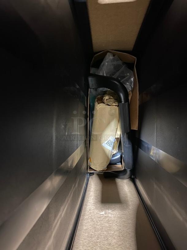 Brand new Rubbermaid Commercial 3-tier black utility cart, model D714091, 300 lb capacity, open-sided, packaged.