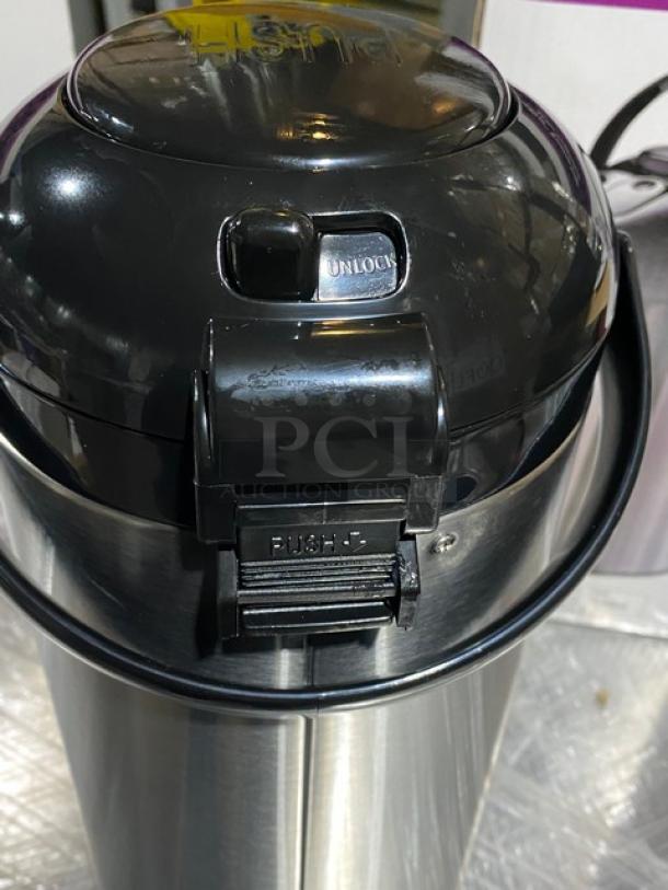 Brand new Service Ideas SteelVac Air Pot SSA300, 101.4 oz capacity, stainless steel, pump lid, unlock and push markings.