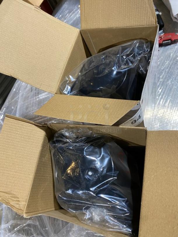 Brand new Vollrath Swirlserve black insulated beverage servers in original packaging, ready for auction.