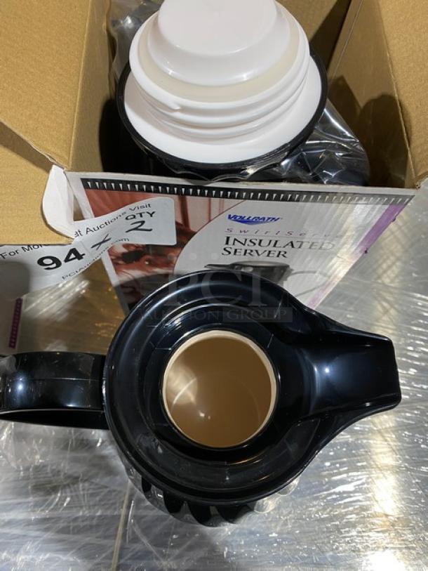 BRAND NEW Vollrath Swirlserve Series Black Tilt & Pour Insulated Beverage Server, in box with packaging visible.