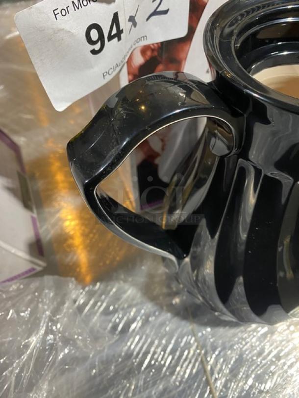 BRAND NEW Vollrath Swirlserve Series Black Tilt & Pour Insulated Beverage Server, with auction tag "94 x 2" visible.