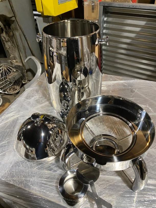 Brand new Winco 905B coffee urn, 5-gallon capacity, stainless steel mirror finish, with fuel holder base.