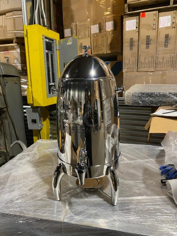 Brand new Winco Virtuoso Series 5 Gal. coffee urn, stainless steel, mirror finish, with fuel holder base, Model 905B.