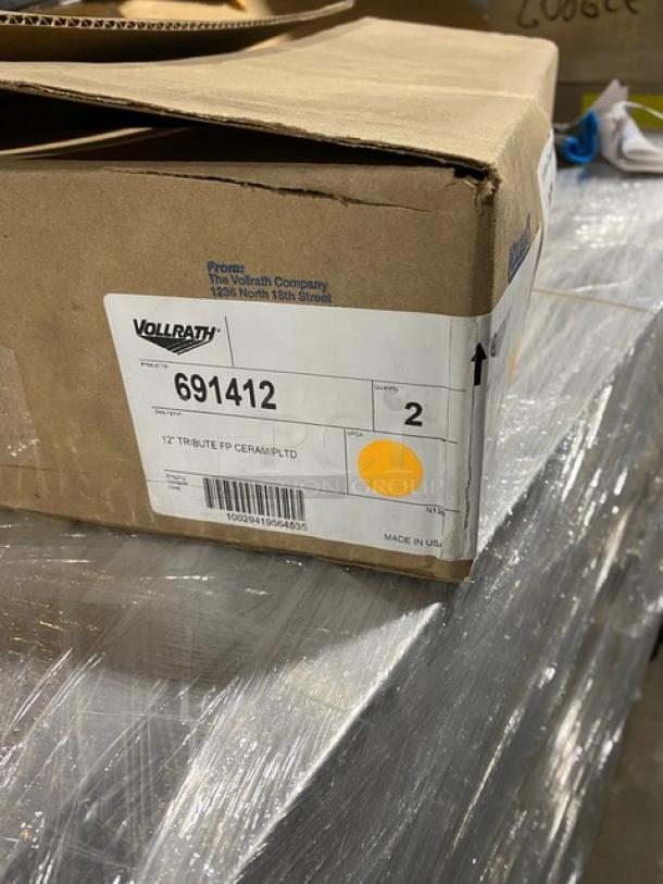 New Vollrath Tribute Series stainless steel 12" induction-ready fry pan, Model 691412. Box label shows item details.