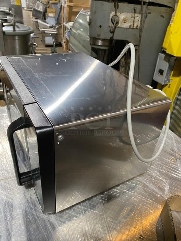 Brand new Amana RMS10TSA commercial stainless steel 1000W microwave oven, digital controls, 120V, on legs.