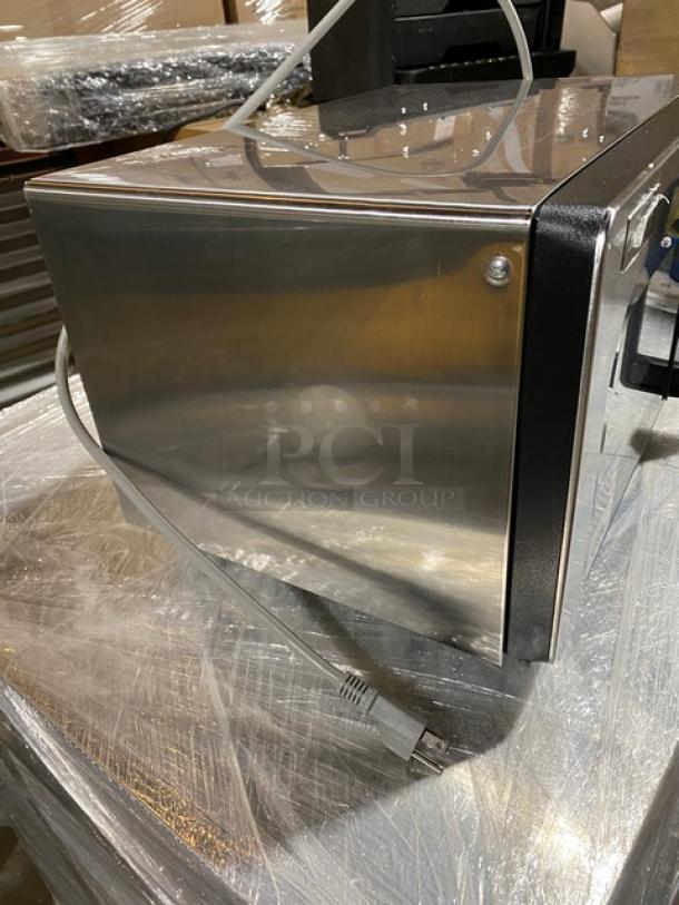 Brand new Amana RMS10TSA stainless steel countertop microwave, 1000W, electric, with digital push button control, SN: 2407140124.