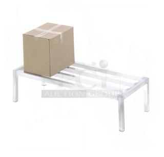 Brand new Channel ADE2460 aluminum dunnage rack, 60"x24", 2,000 lb. capacity, on legs, with box on top.
