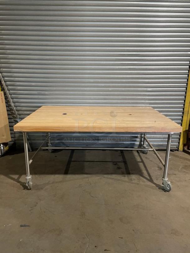 Commercial wooden butcher-block style worktop, 72"x48", lightly used, rectangular, on casters. Ideal for prep work.