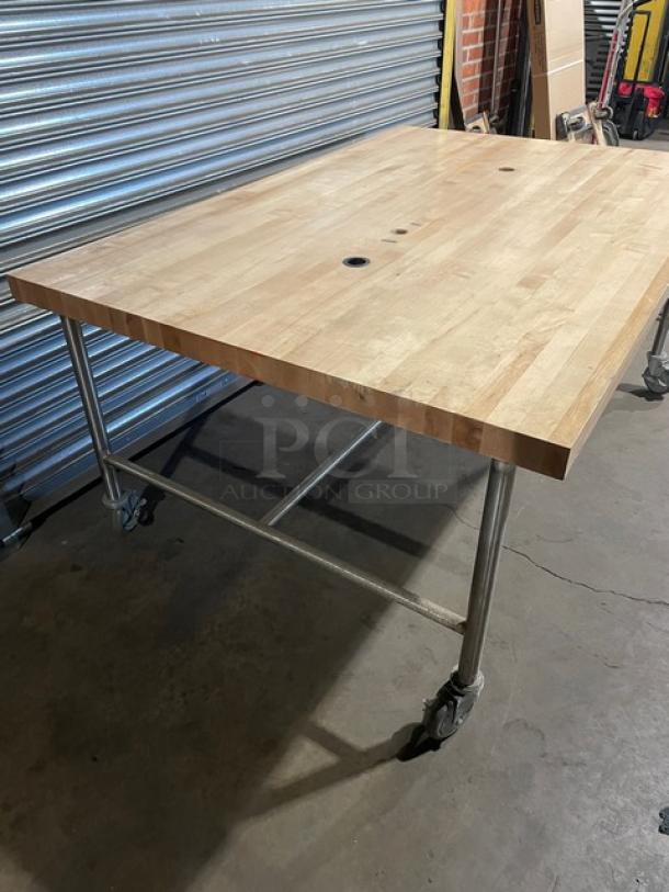 Lightly used commercial butcher-block style worktop, 72"x48", on casters, wooden surface with metal frame.