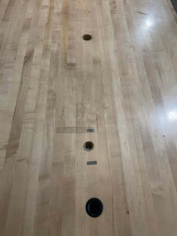 Lightly used commercial wooden butcher-block style worktop, 72"x48", featuring caster wheels.