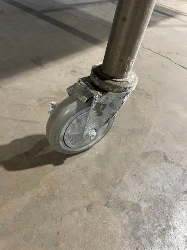 Commercial butcher-block style worktop table on caster. Lightly used, 72"x48", rectangular wooden surface.