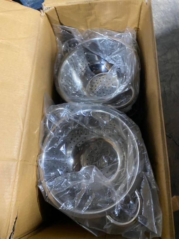 Brand new ABC commercial stainless steel perforated colander with handles, packaged in a box.