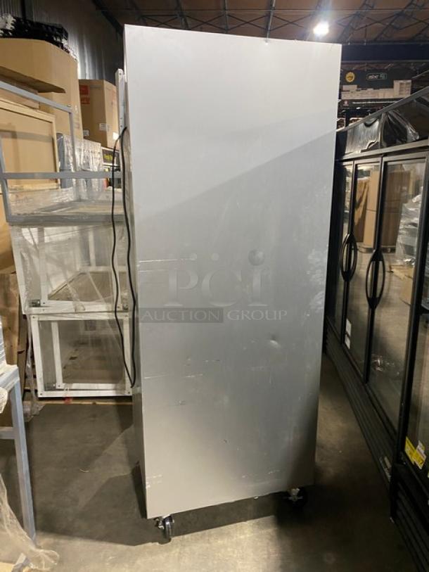 Traulsen G10010 commercial stainless steel refrigerator, used, single door, Energy Star, on casters, visible wear and dents.