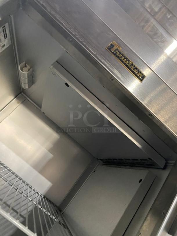 Traulsen G-Series stainless steel reach-in refrigerator, model G10010, Energy Star certified, with label, on casters.