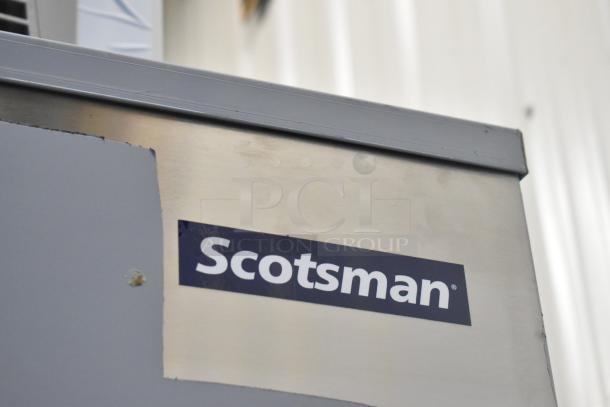 Brand new 2024 Scotsman FS1222A-32B flake ice machine, stainless steel, slight dent, on 2025 Scotsman ICS730-A bin.