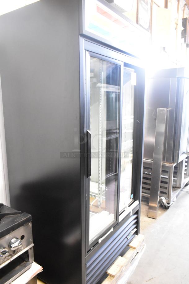 Brand new 2025 True GDM-33-HC-LD cooler, 2-door reach-in, poly-coated racks, 115V, 1 phase, minor scratches, metal exterior.