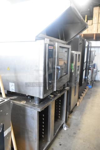 Rational SCC WE 62 combi convection oven with UltraVent Plus hood on a double pan rack stand. Stainless steel. 480V, 3-phase.