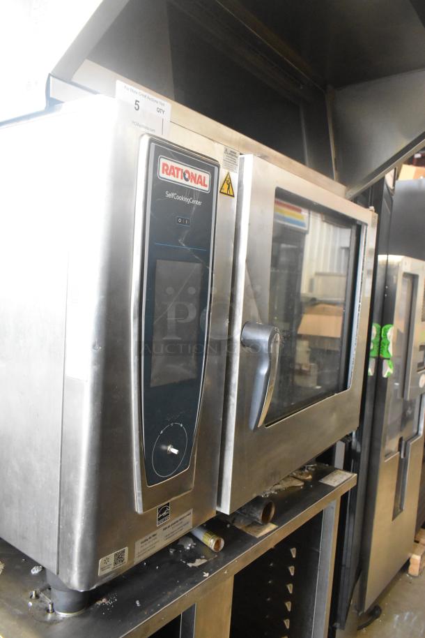 2019 Rational SCC WE 62 stainless steel combi oven with Rational UltraVent Plus hood, mounted on double pan rack stand.