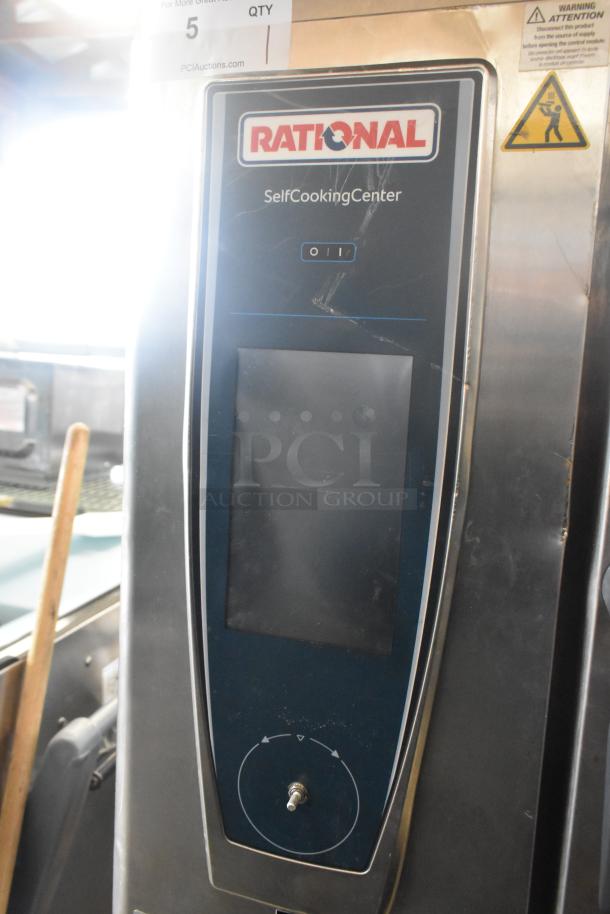 2019 Rational SCC WE 62 Self Cooking Center oven with UltraVent Plus hood, stainless steel, on double pan rack. Model details visible.