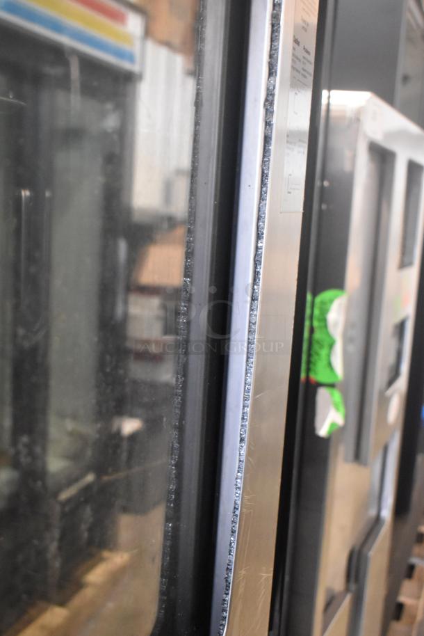 Close-up of a 2019 Rational SCC WE 62 stainless steel commercial combi oven door, showing glass seal and frame detailing.