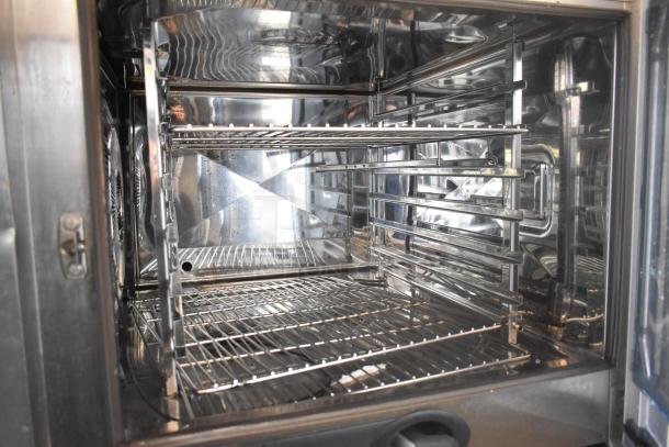 2019 Rational SCC WE 62 stainless steel combi convection oven interior with multiple racks, in excellent condition.